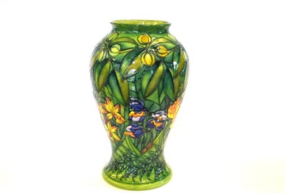 Lot 715 - A William John Moorcroft Rainforest Pattern Vase, designed by Sally Tuffin, on a green ground,...