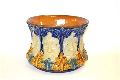 Lot 731 - A Doulton Stoneware Jardiniere, modelled with faces with various expressions, in blues and...