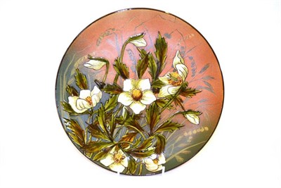 Lot 740 - A Linthorpe Pottery Charger, shape No.299, painted with white flowers, impressed factory marks...