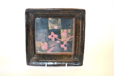 Lot 749 - John Maltby (b.1936): A Stoneware Square Dish, painted with flowers on a chequered ground,...