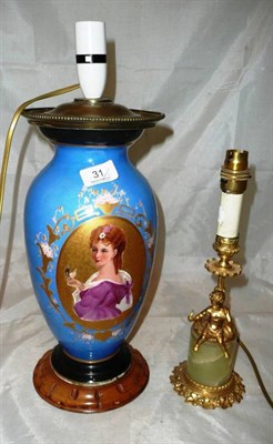 Lot 31 - A porcelain and gilt lamp base and an onyx and gold lamp base (2)