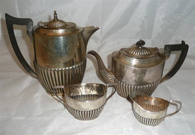 Lot 32 - Three piece silver tea set and a plated water jug