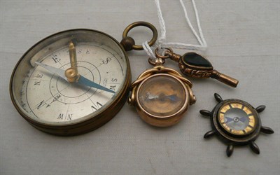 Lot 87 - A compass fob, a watch key and two compasses (all a.f.)