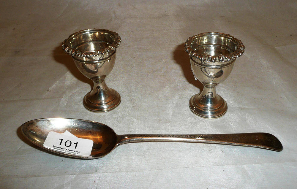 Lot 101 - Two Irish silver egg cups and a London tablespoon