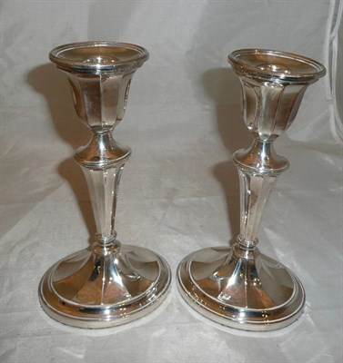Lot 120 - A pair of silver candlesticks
