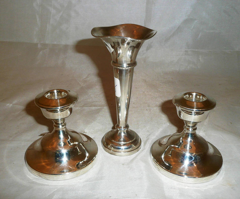Lot 125 - Pair of silver dwarf candlesticks and a posy vase