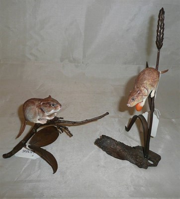 Lot 128 - Two porcelain mice on bronzed metal twigs (2)