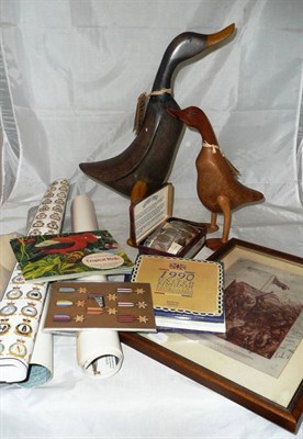 Lot 148 - A quantity of coins, trade cards, military posters etc, two wooden models of ducks