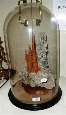 Lot 158 - A carved Fairytale Castle under a glass dome