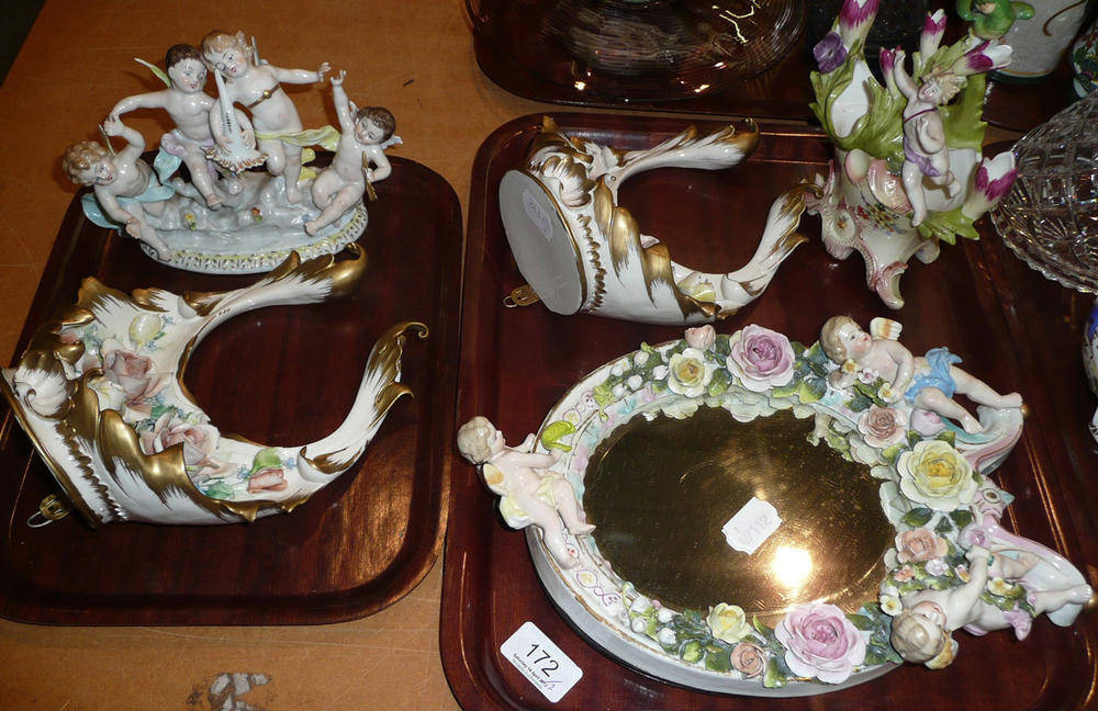 Lot 172 - Floral encrusted easel mirror decorated with cherubs, cherub figure group, cherub basket and a pair