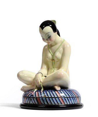 Lot 767 - "Odalisque ": A Lenci Earthenware Figural Box, modelled as a nude oriental girl with long black...