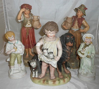 Lot 212 - A tray of Continental bisque figures including a girl with kittens
