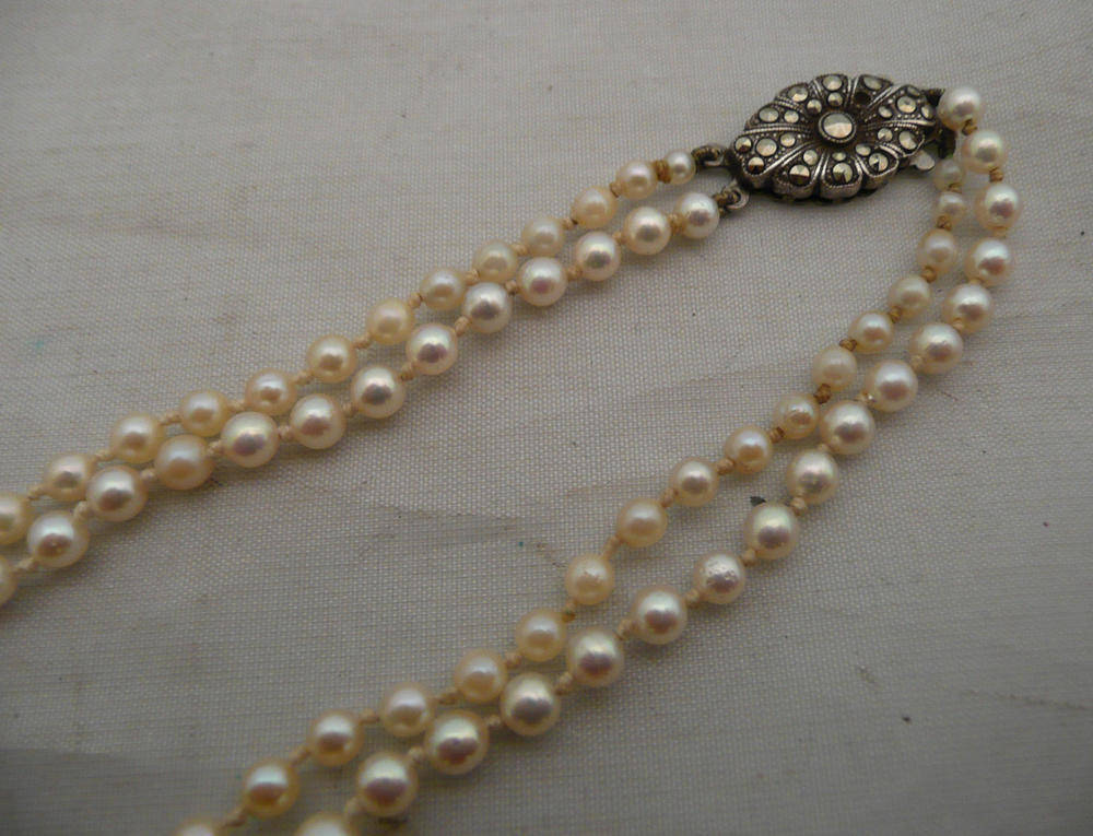 Lot 220 - A two strand cultured pearl necklace, boxed