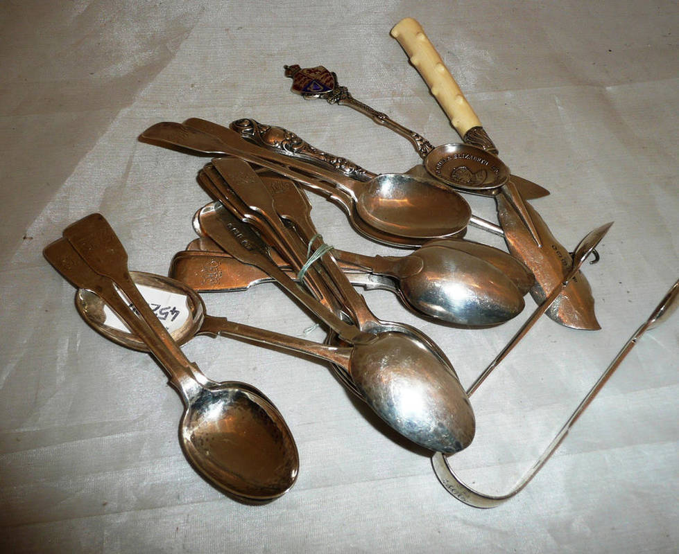 Lot 222 - A quantity of silver teaspoons, tongs, a button hook and butter knives