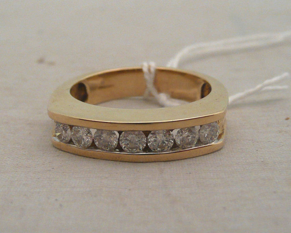 Lot 233 - A 9ct gold diamond half eternity ring