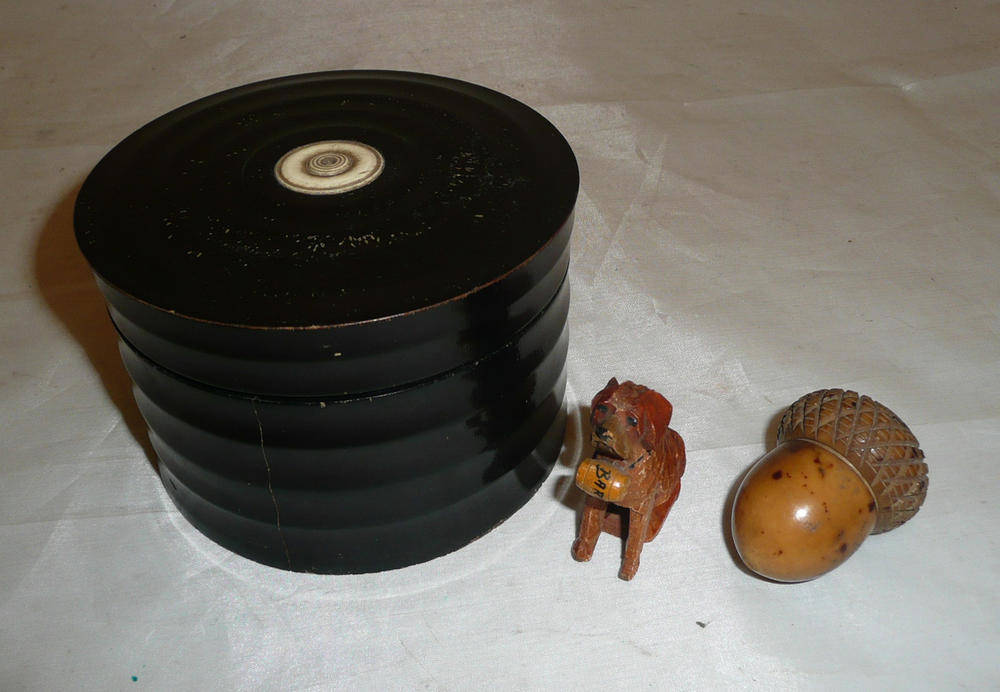 Lot 255 - A wooden acorn thimble holder and an ebonised box with a small St Bernard wooden dog