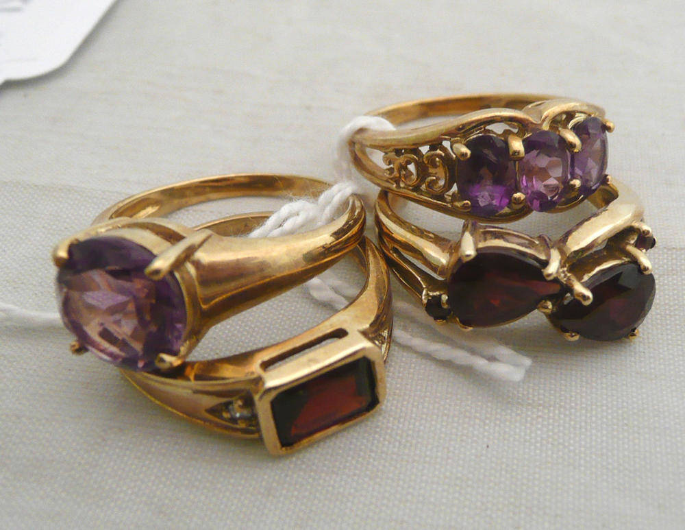 Lot 267 - Two 9ct gold garnet rings and two 9ct gold amethyst rings