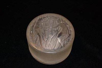 Lot 777 - A Rene Lalique Deux Figurines Frosted Glass Round Box, moulded mark R.LALIQUE, 7cm, 4cm high