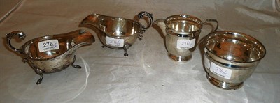 Lot 276 - Two silver sauce boats, a silver milk jug and sugar bowl (4)