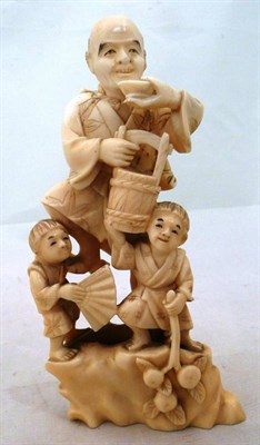 Lot 292 - 19th century Japanese ivory man with two boys