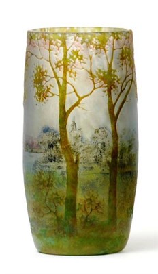 Lot 779 - A Daum Nancy Enamelled Cameo Landscape Vase, decorated with a continuous scene of trees, signed...