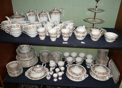 Lot 316 - An extensive Paragon 'Country Lane' pattern tea and dinner wares on two shelves