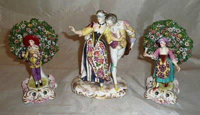 Lot 346 - A pair of Sampson of Paris flower encrusted figures and a late 19th century figure group (restored)