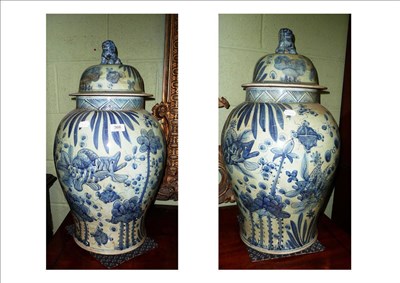 Lot 368 - Pair of blue and white vases and covers
