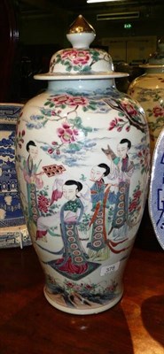 Lot 378 - A Chinese famille rose vase and cover decorated with figures beneath a tree