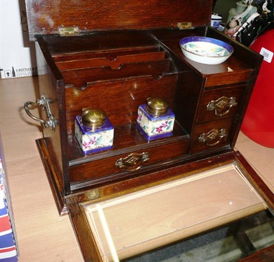 Lot 387 - A late 19th century oak writing cabinet