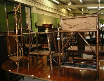 Lot 492 - A bamboo stick stand, bamboo two tier occasional table and a bamboo three tier corner whatnot