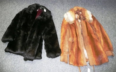 Lot 532 - A brown suede and fur-trimmed zip-front jacket and brown rabbit fur jacket