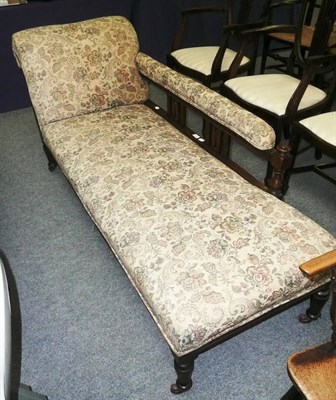 Lot 539 - An upholstered oak-framed chaise longue