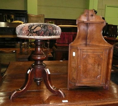 Lot 546 - A Victorian mahogany revolving piano stool and a hanging cupboard