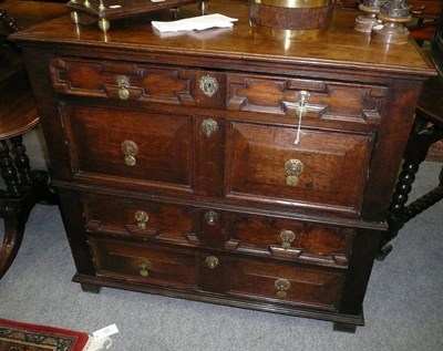 Lot 550 - An early 18th century oak straight front chest, in two parts, geometric moulded two-as-one...