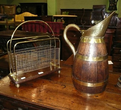 Lot 551 - A brass and mahogany magazine rack and a coopered oak jug