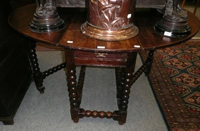 Lot 553 - 18th century oak barley twist drop leaf table with single drawer