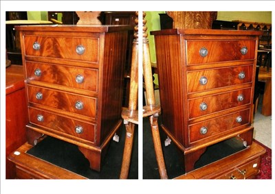 Lot 565 - A pair of reproduction mahogany bedside chests