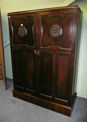 Lot 594 - An oak compactum wardrobe