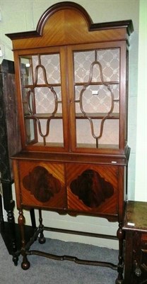 Lot 597 - An Edwardian inlaid mahogany china cabinet on cupboard stand