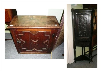 Lot 598 - A panelled oak cupboard and a Victorian oak corner cupboard on stand