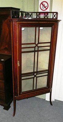 Lot 601 - An Edwardian inlaid mahogany glazed standing corner cupboard