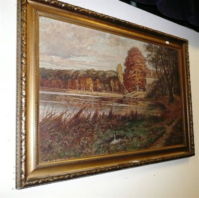 Lot 620 - Oil on canvas of an Autumn landscape signed 'Oswald Getty' (hole in canvas)