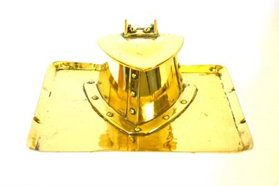 Lot 810 - A Scottish Arts and Crafts Brass Inkwell, of triangle form with hinged cover, on an oblong...