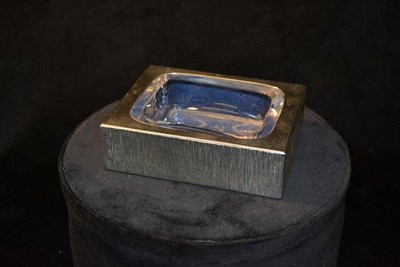 Lot 811 - A Contemporary Silver and Glass Ashtray, by Adrian Gerald Benney, of rectangular form with textured