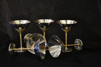 Lot 812 - Stuart Devlin (b.1931) for Viners: A Set of Six Stainless Steel Champagne Goblets, with gilt...