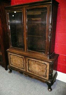 Lot 650 - A walnut display cabinet