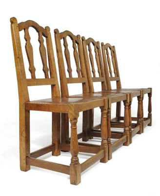 Lot 814 - A Set of Four 1920's/30's Robert "Mouseman " Thompson Oak Chairs, with shaped top rail, vase...