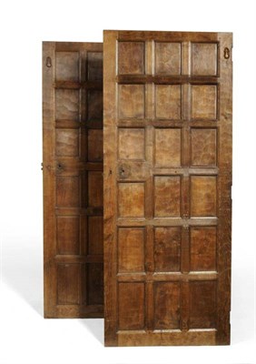 Lot 815 - A Pair of Robert  "Mouseman " Thompson Panelled Oak Doors, each with eighteen panels, both with...