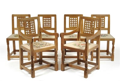 Lot 822 - A Set of Six (4+2) Robert  "Mouseman " Thompson Oak Lattice Back Dining Chairs, on two...